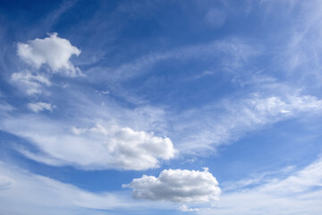 Fototapeta premium clear blue sky background,clouds with background, Blue sky background with tiny clouds. White fluffy clouds in the blue sky. 