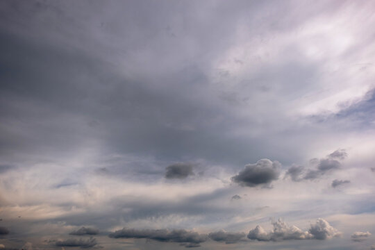Dark and Moody Thunderstorm Clouds Forming in the Sky Before Heavy Rainfall and Severe Weather,
Dark sky with stormy clouds,Dark clouds before a thunder-storm,clouds before rain