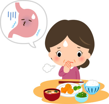 胃の調子が悪く食事を摂るのを躊躇っている中年女性