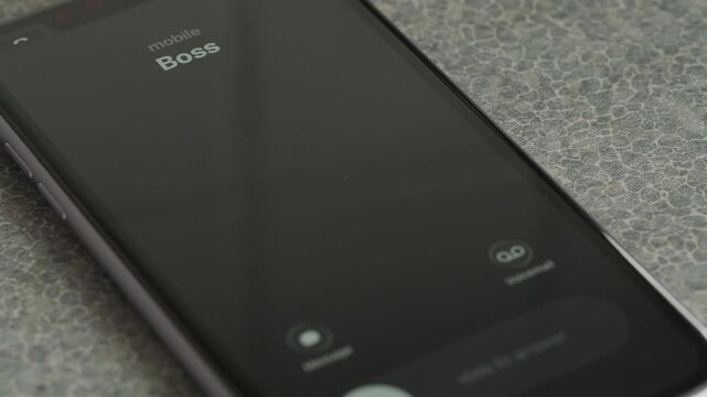 Incoming call from Boss on smartphone macro video.
