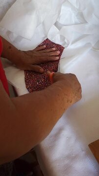 Seamstress Cutting Interfacing Fabric for Dress Sleeve