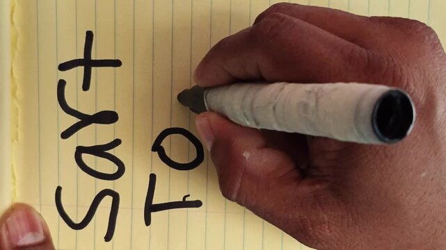 Person Writing Start Today on Sticky Note