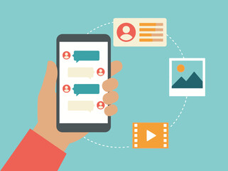 Fototapeta premium Hand Holding Smartphone with Mobile Messenger App and Social Media Multimedia Sharing Icons