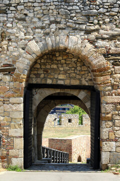 Stone archway and open wooden gate at Zindan Gate in Kalemegdan Fortress, Belgrade, Serbia