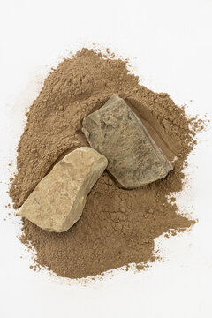 Top-Down Still Life of Black Soil Chunks and Brown Clay Powder