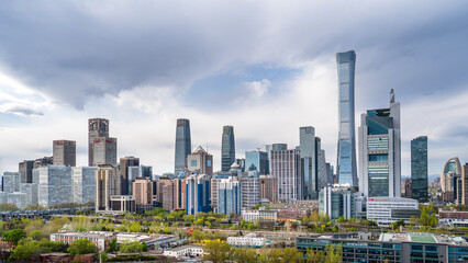 Obraz premium Springtime cityscape of Beijing's CBD skyline and rail transit.