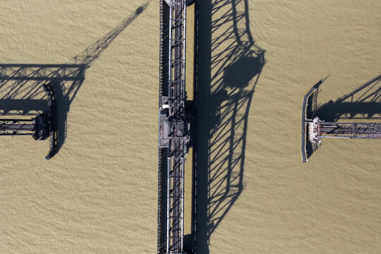 Railway swing bridge top down view with shadow on Maumee river, ohio