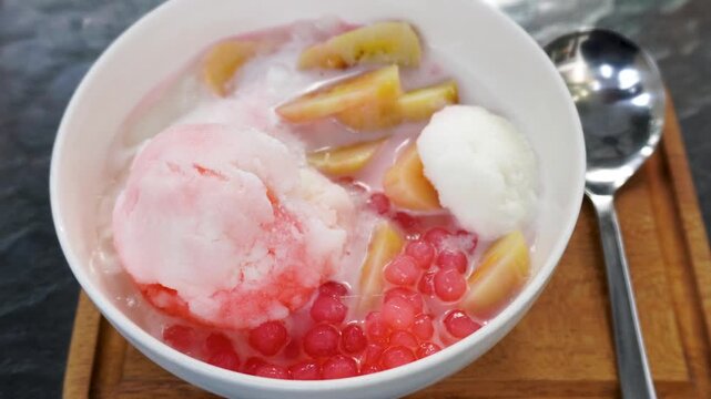 Indonesian traditional dessert pallu butung ice with shaved ice and syrup