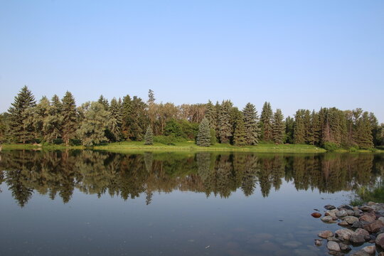 reflection of trees in the lake, William Hawrelak Park, Edmonton, Alberta