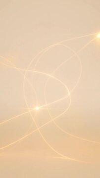 Abstract golden light trails swirling in smooth motion, glowing particles on soft beige background, elegant flowing curves for luxury motion graphics