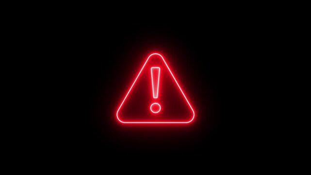 Red neon warning sign with exclamation mark on a dark background, conveying caution and alert.