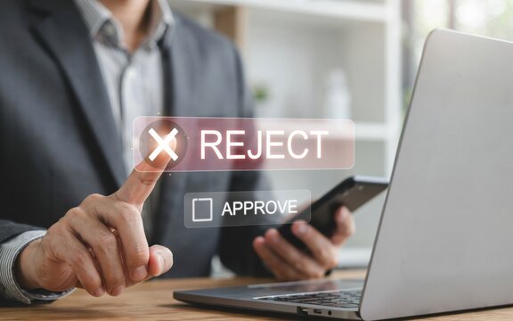 Businessman choosing to reject a digital application