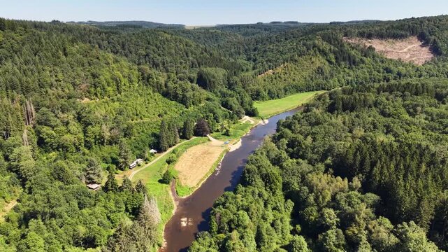 Aerial footage of Semois river through the Ardennes forest, Belgium