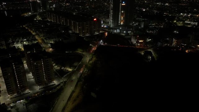 Duplex towers with MIG Complex and under construction illuminated tower building at Chitrapuri Hills, manikonda, hyderabad, telangana, india. night time, push in shot, drone shot, 4k.