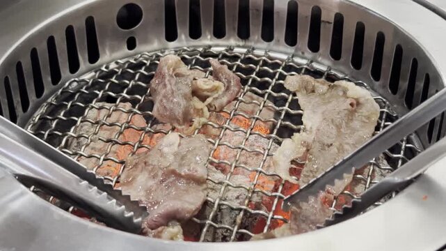 Close-up of premium A5 Wagyu beef grilling over a hot barbecue grill, showcasing rich marbling, sizzling texture, and gourmet dining experience.