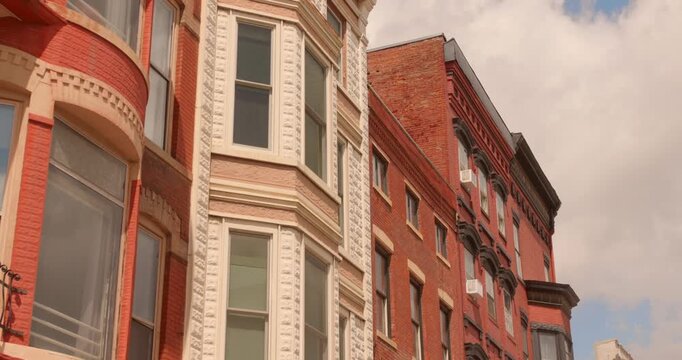 Close-up building facade view of historic Galena architecture featuring arched bay windows and decorative details, Galena, Illinois, USA