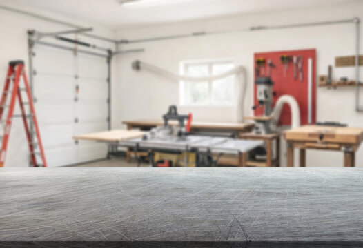 craft workshop or garage interior with tools and empty metal surface on foreground