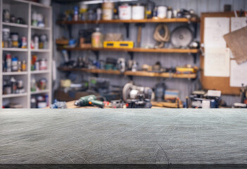 Fototapeta premium craft workshop or garage interior with tools and empty metal surface on foreground