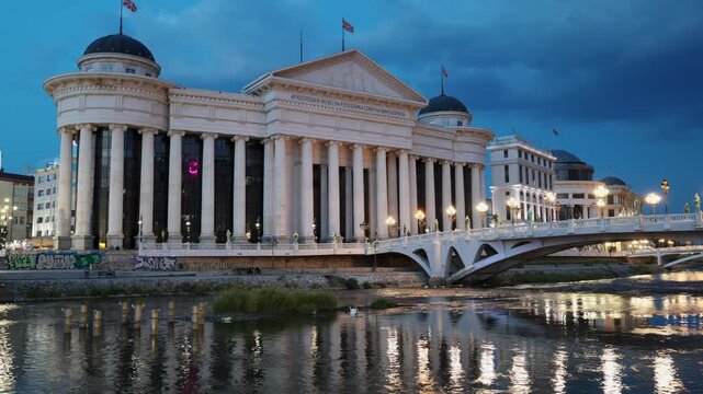 Skopje, North Macedonia - August 6, 2025: Exterior of Archaeological Museum building and adjacent square, Skopje. Place of storage and study, classification of historical artifacts, evening time.