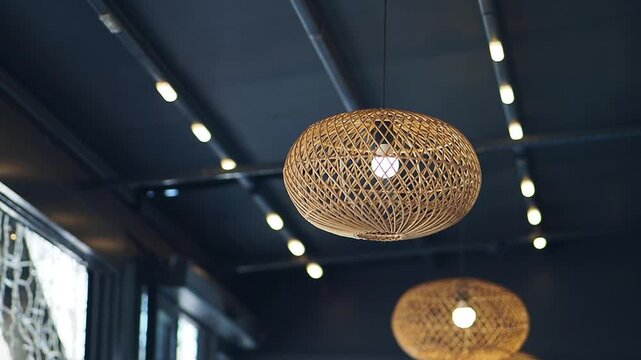 Hanging light fixtures in modern cafe space