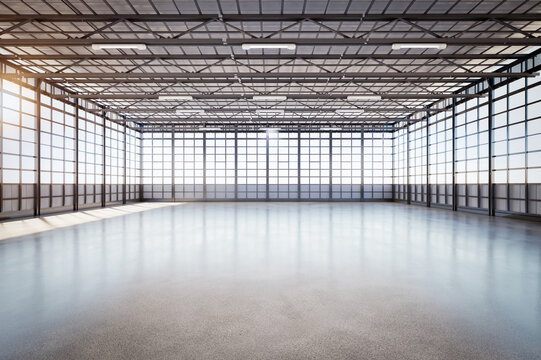 Empty factory interior filled with natural light