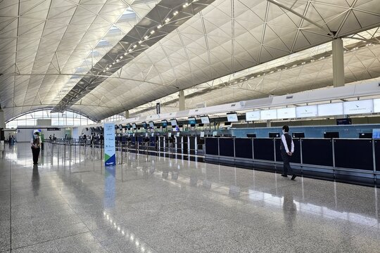 Hong Kong, China - July 01, 2026: Cathay Pacific check-in counters inside Hong Kong International Airport terminal.