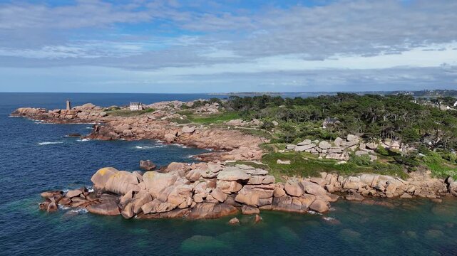Large boulders pink granite coast Perros Guirec Brittany France drone aerial view