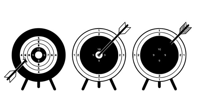 Archery targets set with arrows embedded in bullseyes featuring sport equipment, precision, and competition with outdoor setting and target practice