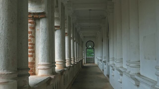 Ancient castle corridor standing still, historical ruins with stone columns and red bricks, architectural heritage site, travel and history background