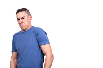 Obraz premium Casual caucasian man standing while grimacing in disgust