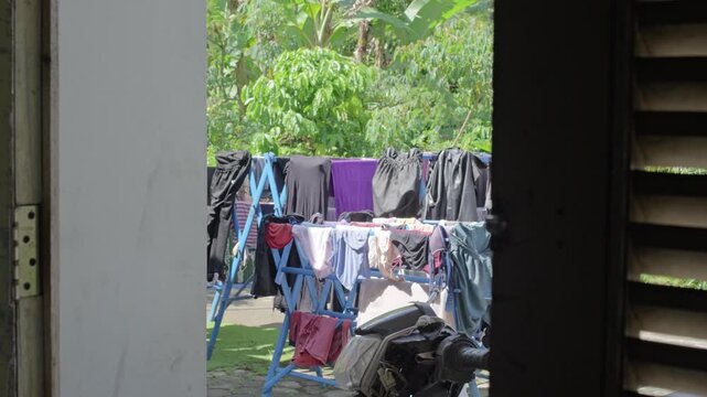 Cluttered Backyard with Laundry and Debris.