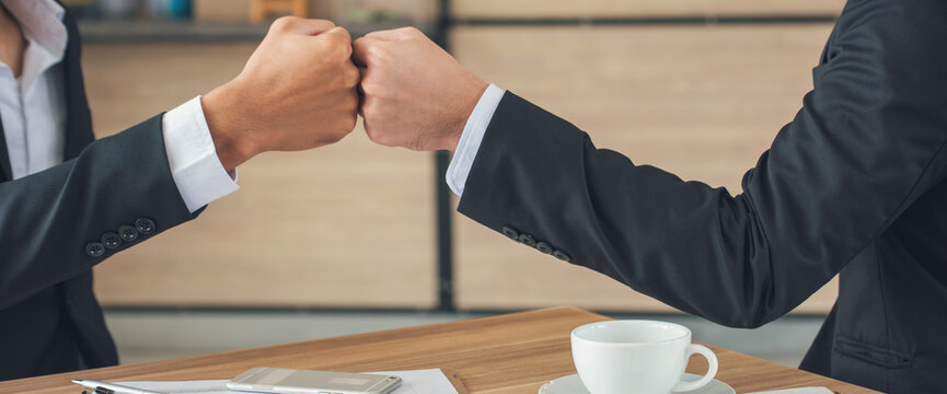 Banner Fist bump Volunteer mission business partner with copy space. Two people multiracial fist bump hands stack join arm together. Team bump fist together Banner diversity solidarity teams Partner