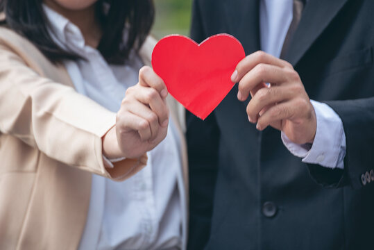 Couple lover hands holding red heart concept. Couple hands holding love. Lover relationship romance romantic partner. Affection togetherness happiness mental wellness commitment emotional dating