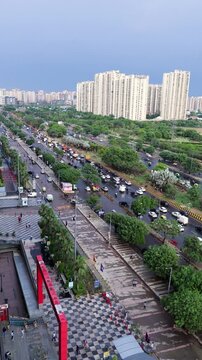 Aerial view of Delhi NCR cityscape. Urban traffic and modern residential towers in Noida.
