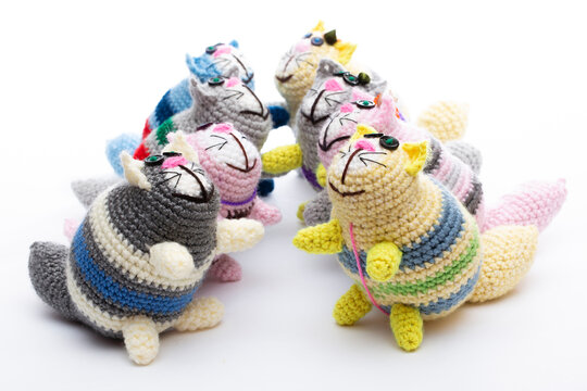 A crocheted cat toy on a white background