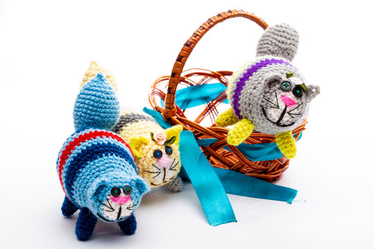 A crocheted cat toy on a white background