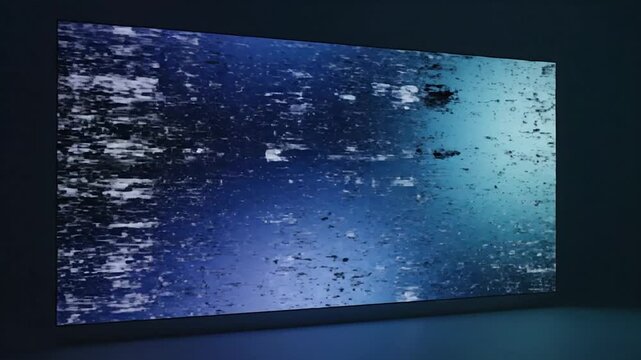 Abstract blue digital noise displayed on a large wall screen