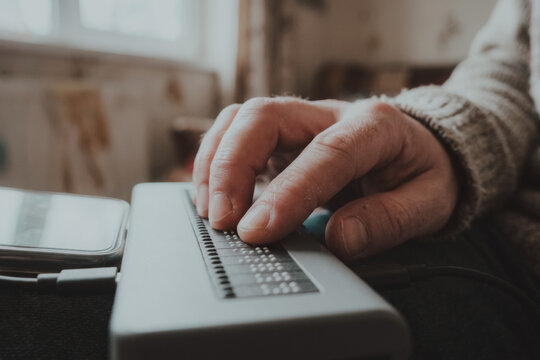 Person using a braille display device