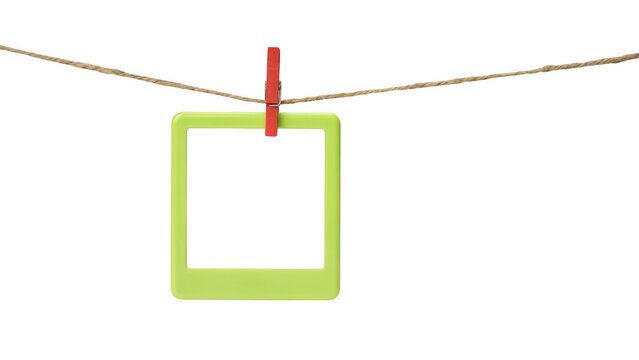 Green photo frame hanging on a clothesline isolated on transparent background