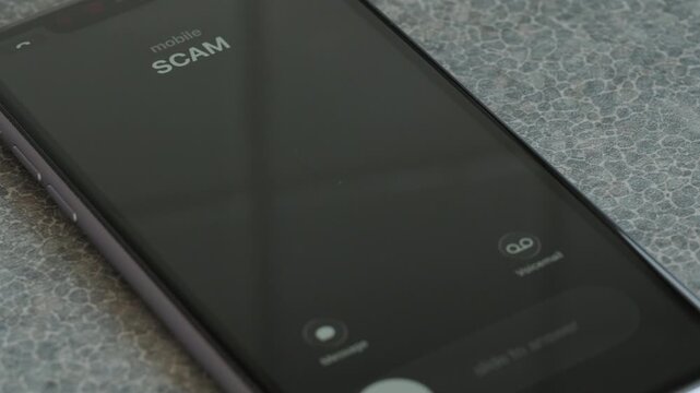 Incoming scam call on smartphone macro video.