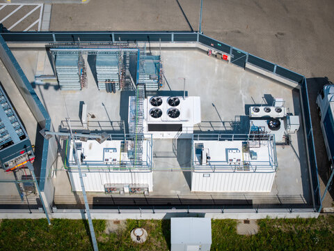 Aerial view of a modern hydrogen refueling station (H2 station) in an industrial logistics area.