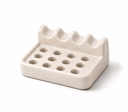 White ceramic toothbrush holder with six slots