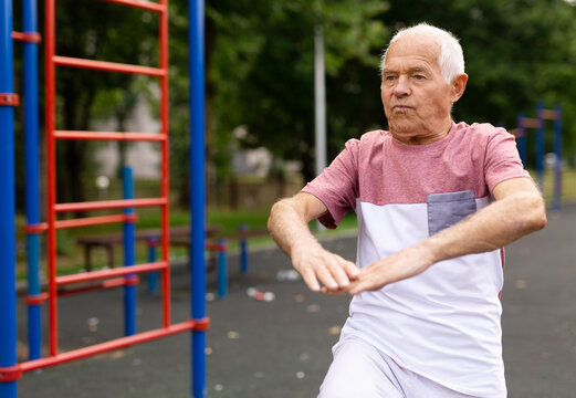 Fitness, sport and healthy lifestyle concept happy senior woman exercising at park