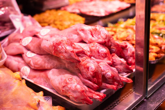 Meat department of supermarket - raw pig carcasses are on display in refrigerator