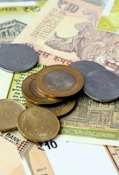 Indian rupee money banknotes and coins on table. India cash bills of INR currency
