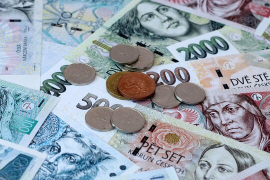 Czech koruna money banknotes and coins on table. Czech Republic cash bills of CZK currency