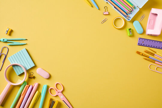 School supplies corner frame with copy space on yellow background