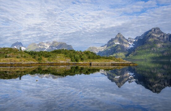 Picturesque fjord landscape at Raftsund fjord, mountains reflected in water, Vester&aring;len, Norway