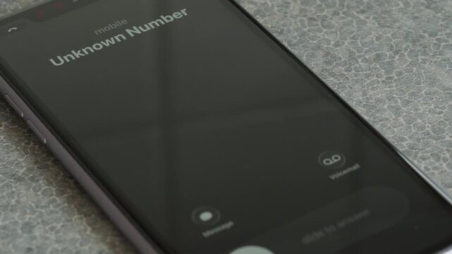 Incoming call from unknown number on smartphone macro video.