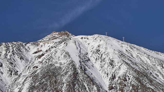 Mount Teide. Mount Teide, A snow-capped mountain peak against a clear blue sky, Teide, Parque Nacional del Teide, Teide National Park, volcano, volcanism, UNESCO World Heritage Site, Tenerife, Canary Islands, Spain